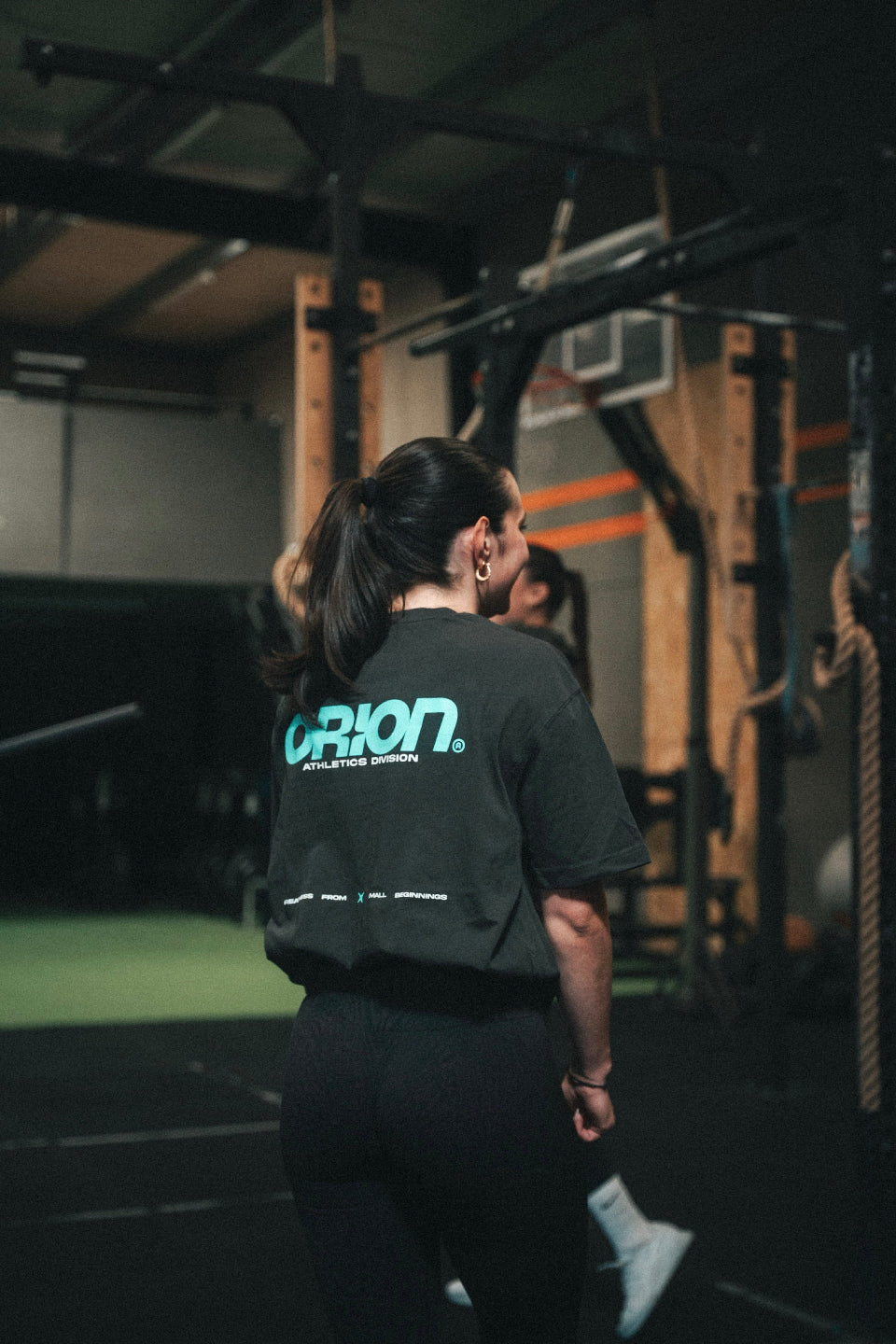 T-shirt CrossFit ORION Athletics noir turquoise athlète entraînement classe